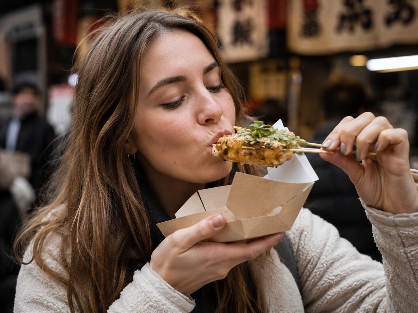 A Woman Eating Taiwanese Food